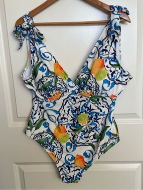 The Chic Hero White Swimsuit with Blue Tile Motifs and Citrus Accents